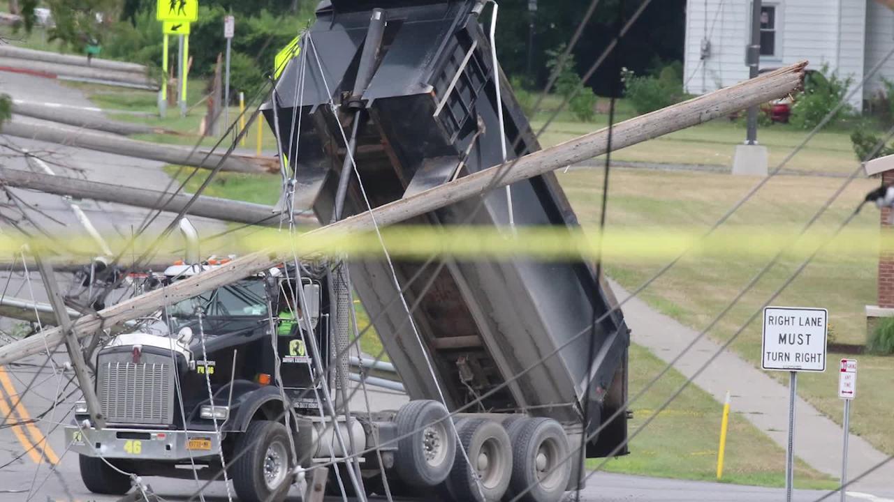 Dump truck knocks over utility poles in Henrietta