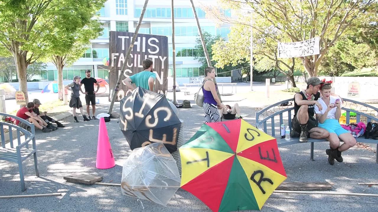 Protesters block CoreCivic headquarters