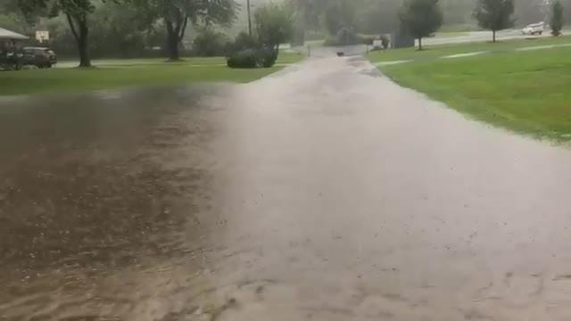 Heavy rain, flash floods covering area roads