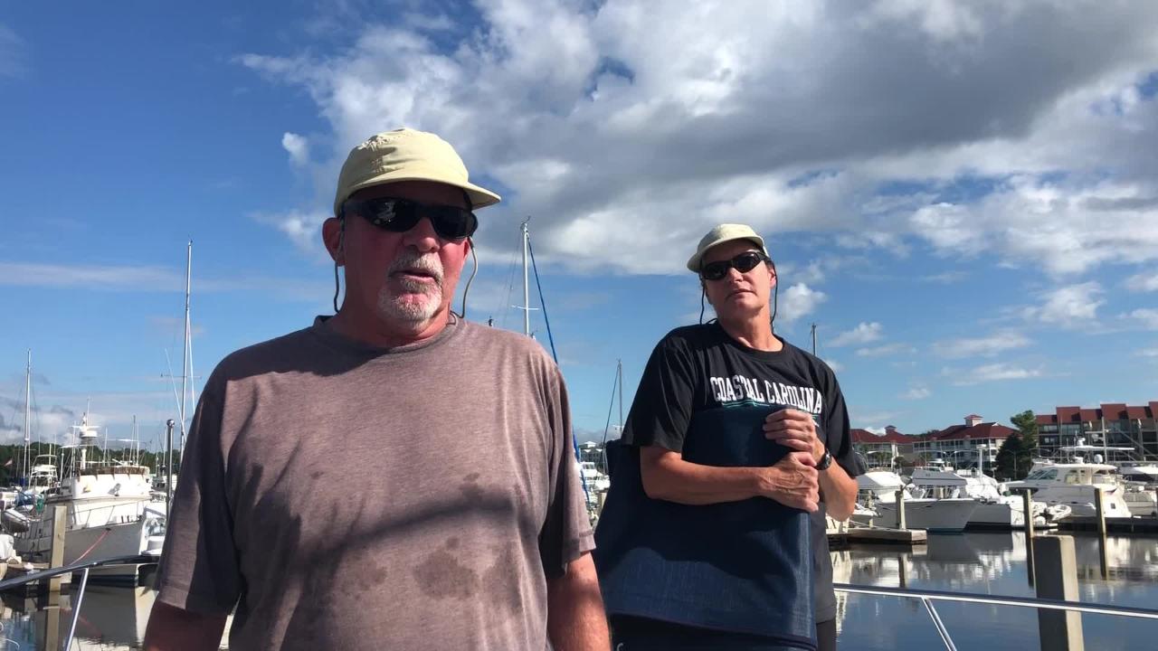 Tropical Storm Florence Man Survives The Hurricane On His Boat - couple in myrtle beach keep an eye on the sky and the docks