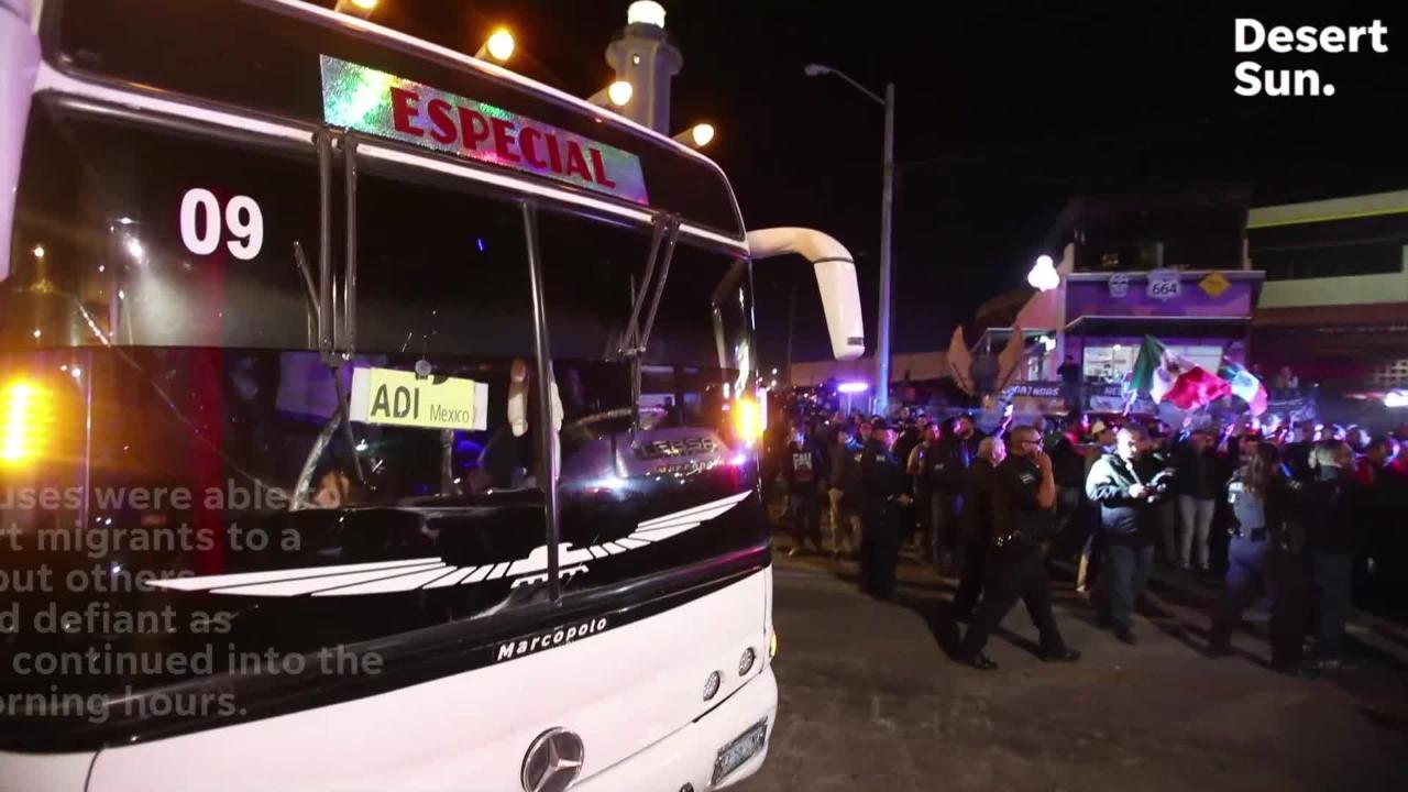 Migrants headed to the U.S. Mexico border are confronted by Tijuana residents