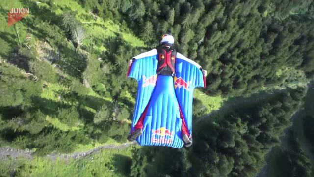 Man flies over mountains in nothing but wingsuit