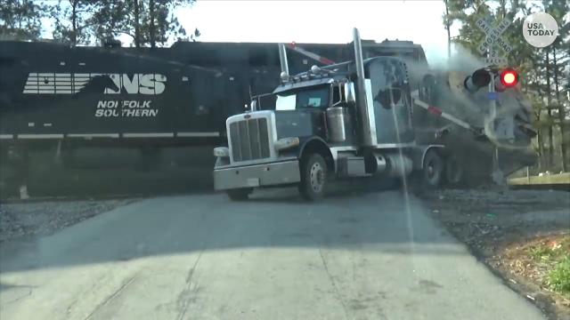 Truck driver escapes seconds before train crash