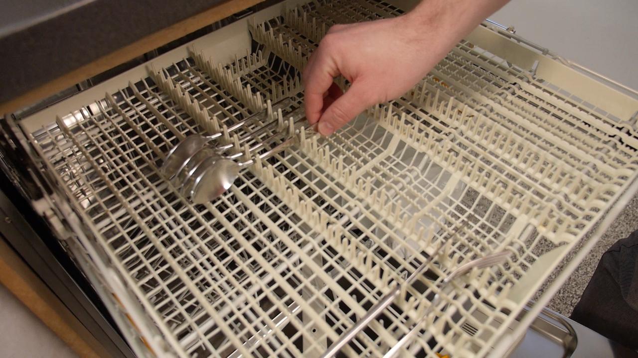 How to load a cutlery basket in a dishwasher?