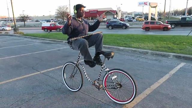 Bicycle Guy rides backward for your smiles