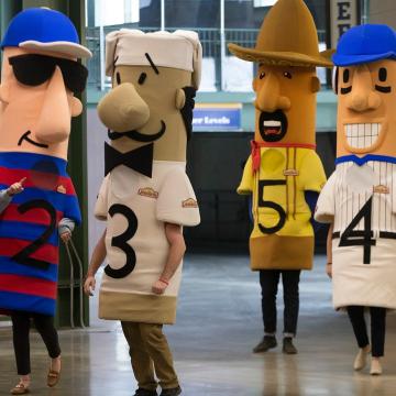 Three Johnsonville Racing Sausages take a fall during Tuesday's race