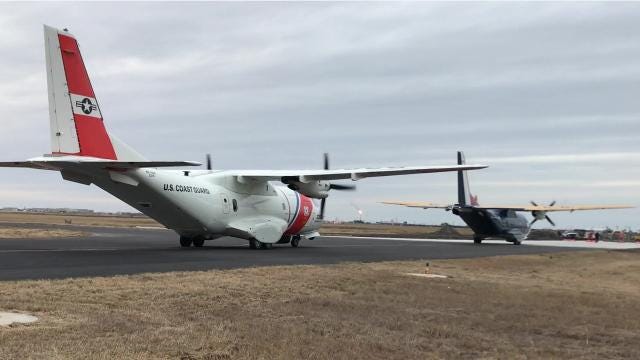 Coast Guard planes sprayed with water as they enter Corpus Christi International Airport