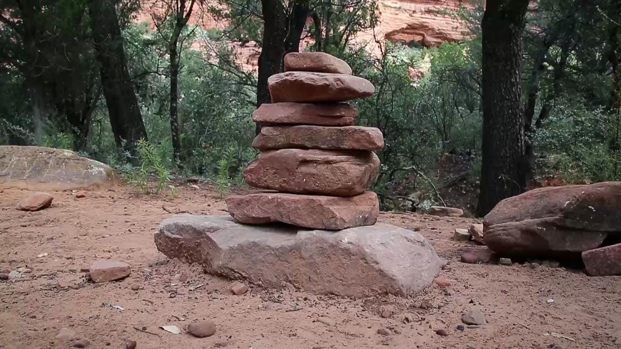Staked Rocks What's with all those stacks of stones in the woods?