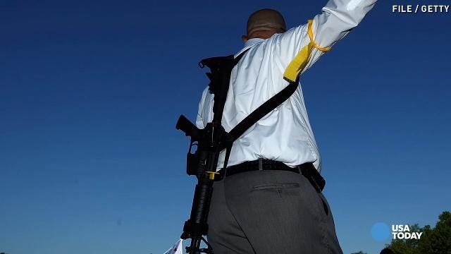 Man Carrying Assault Rifles Police detain men carrying AR-15 rifles