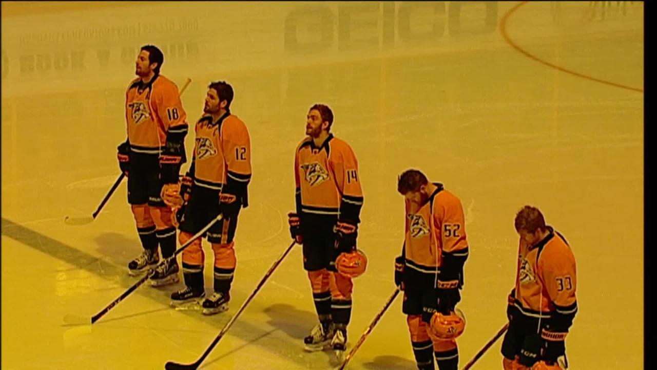 NHL fan singing national anthem, honouring soldier with standing