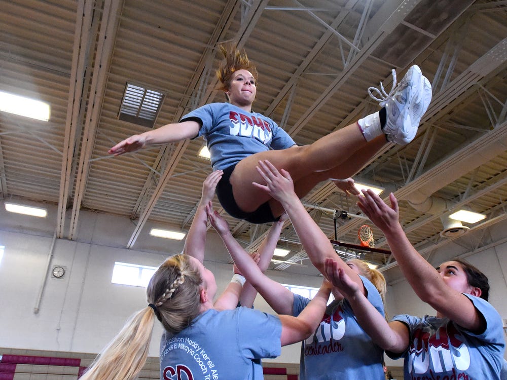 High Flying In Cheerleading For The Team